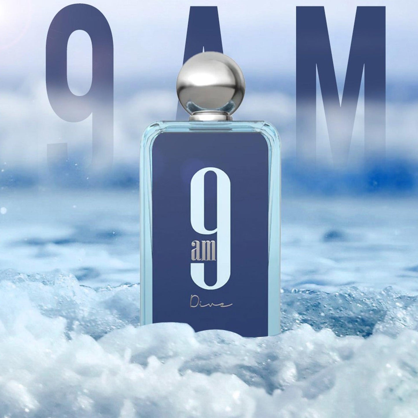 9AM Dive perfume bottle standing amid splashing ocean waves with a bold blue design and silver cap, evoking a fresh aquatic fragrance vibe