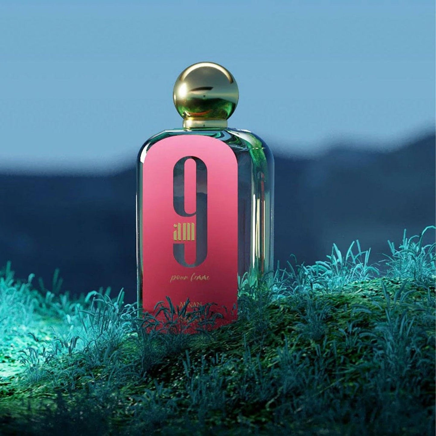 Afnan 9AM perfume bottle on grassy outdoor background.