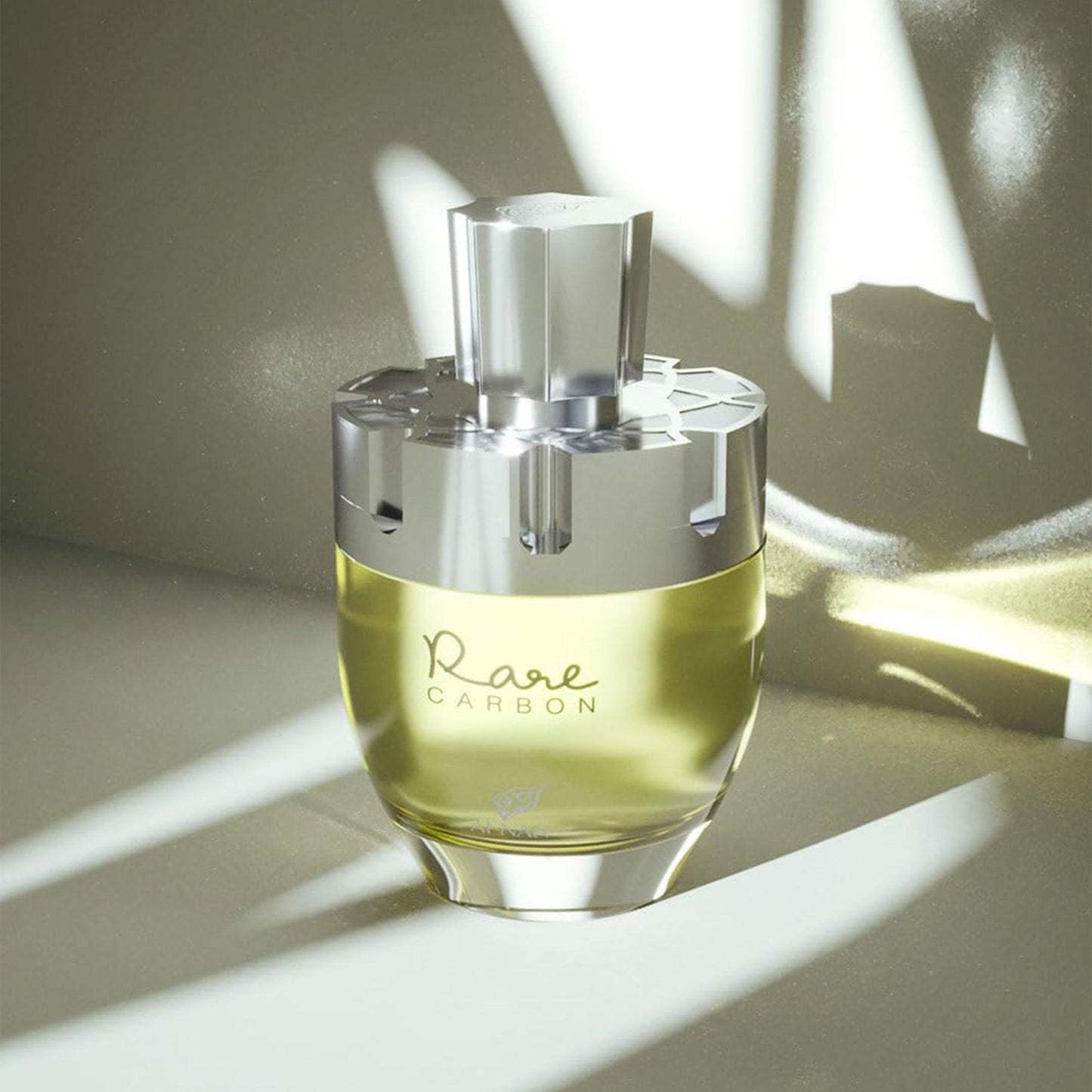 Afnan Rare Carbon perfume bottle with metallic cap in soft light.