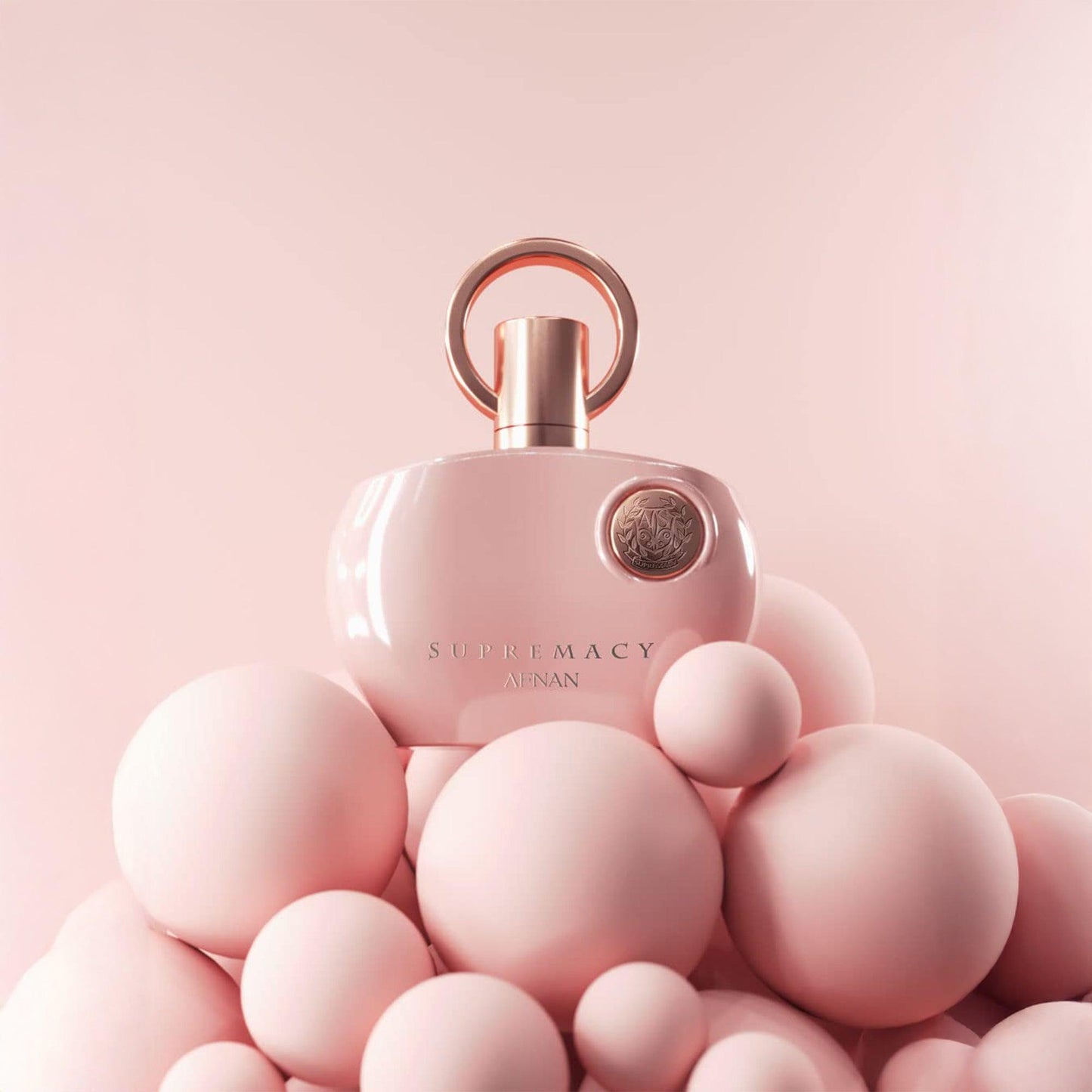 Afnan Supremacy Pink Eau De Parfum bottle on pink background.