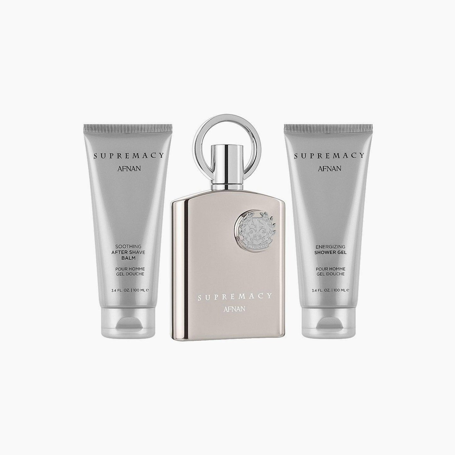 Afnan Supremacy Silver gift set featuring a sleek metallic perfume bottle, an energizing shower gel, and a soothing after-shave balm, all in coordinated silver packaging on a white background.