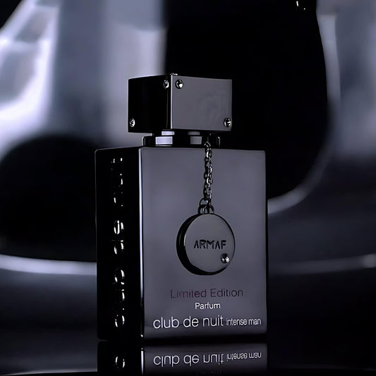 Armaf Club De Nuit Intense Man Limited Edition Parfum sleek black bottle with metallic chain emblem on a glossy dark background