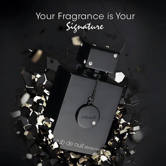 Armaf Club De Nuit Intense Man Pure Parfum black bottle with chain design surrounded by golden shards on a dark background