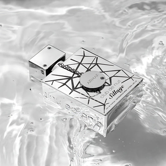 Armaf Club De Nuit Sillage perfume bottle on reflective water surface.