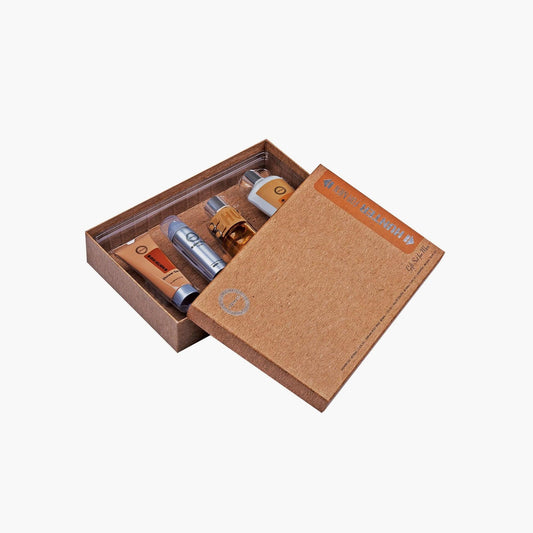 Armaf Hunter Intense gift box set featuring a perfume bottle, deodorant spray, shower gel, and body lotion arranged neatly inside a textured brown presentation box.