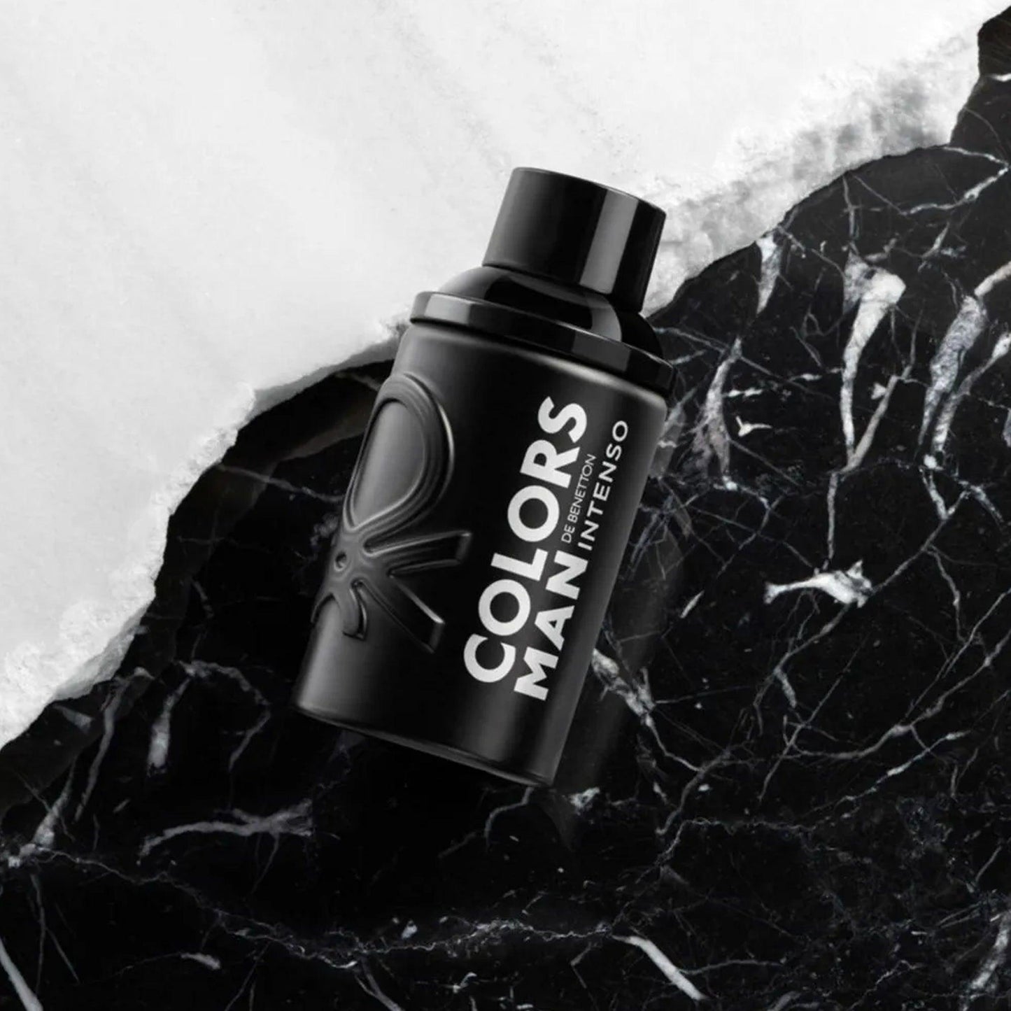United Colors of Benetton Colors Man Intenso Eau De Toilette black bottle placed on a contrasting white and black marble surface