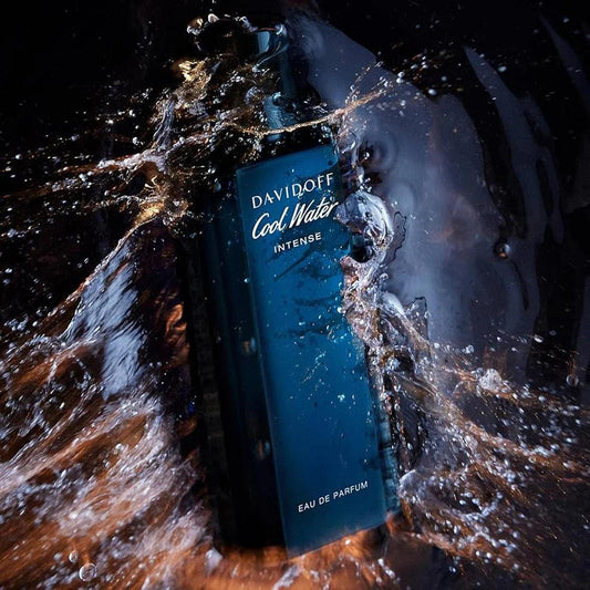 Davidoff Cool Water Intense Eau De Parfum bottle in deep blue surrounded by splashing water, symbolizing freshness and oceanic energy