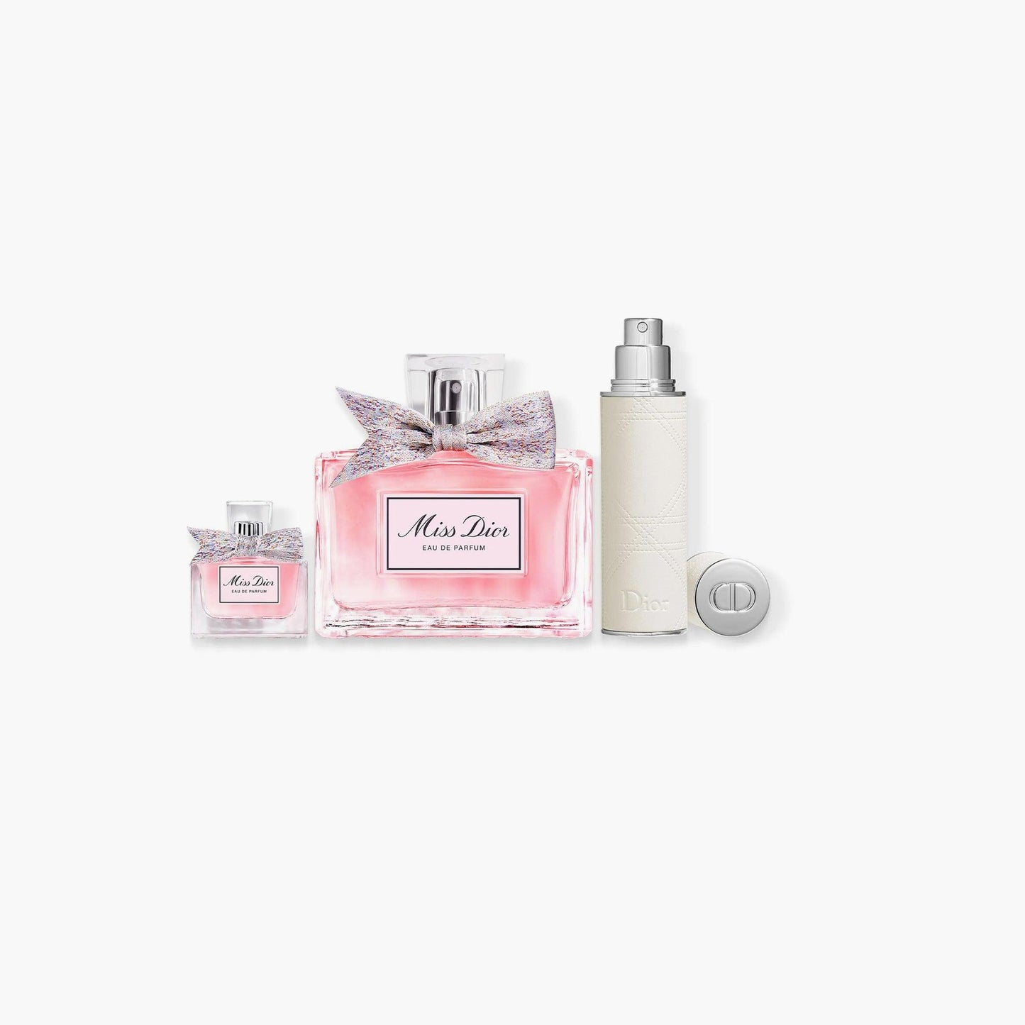 Miss Dior Eau De Parfum gift set with full-size perfume, travel spray, and mini perfume bottle in elegant packaging with colorful bow