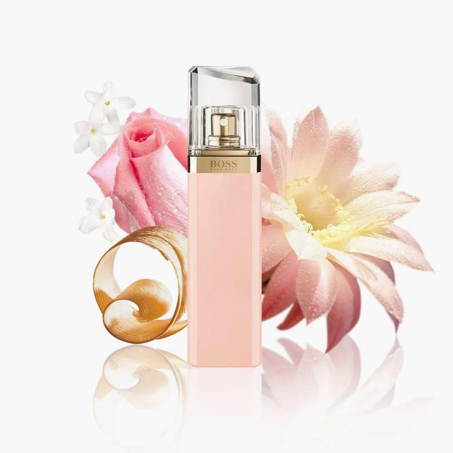 Hugo Boss Ma Vie Pour Femme Eau De Parfum bottle in soft pink color surrounded by delicate roses and blooming flowers on a white background.