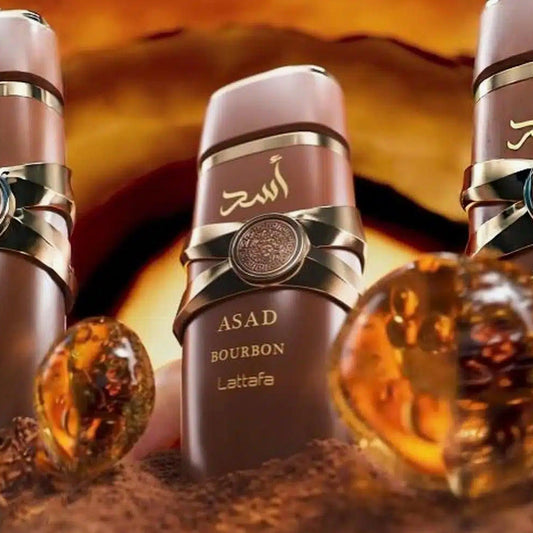 Lattafa Asad Bourbon perfume bottles with amber background.