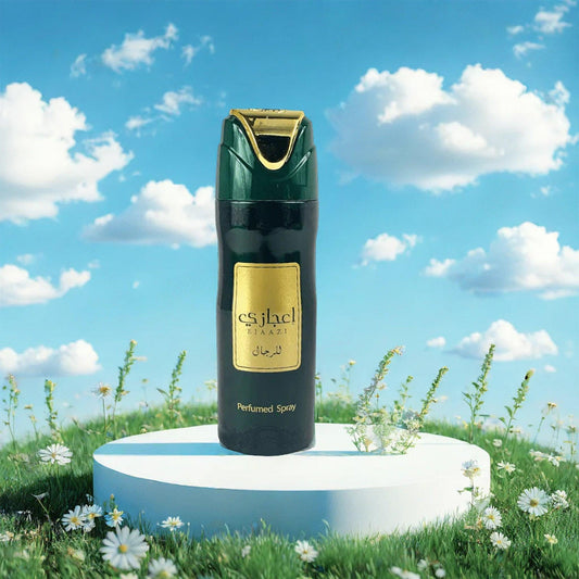 Ejazi Perfumed Spray bottle with green and gold design placed on a round white platform surrounded by grass and daisies under a bright blue sky with clouds