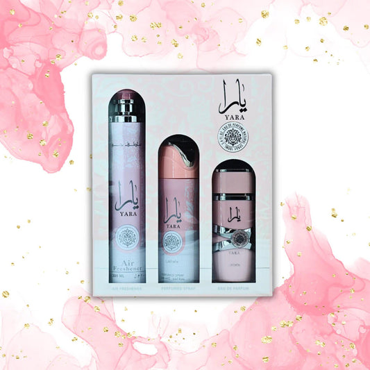 Yara Air Freshener, Perfume Spray, and Eau De Parfum 3-piece set in pink packaging, with a pink watercolor background featuring gold flecks