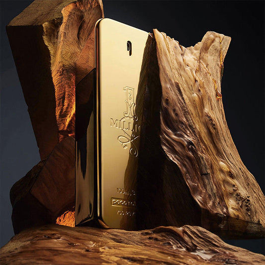 Paco Rabanne 1 Million Eau De Toilette gold bar-shaped perfume bottle placed between rugged wooden textures on a dark background