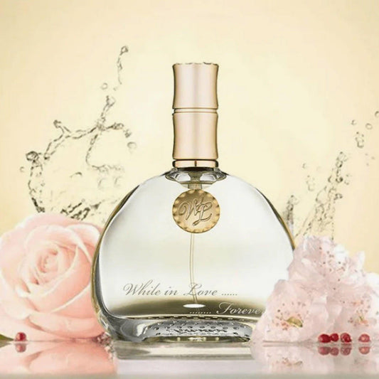 Rasasi While in Love Forever Eau De Parfum bottle displayed on a soft pastel Rasasibackground with pink roses, delicate blossoms, and water splash elements.