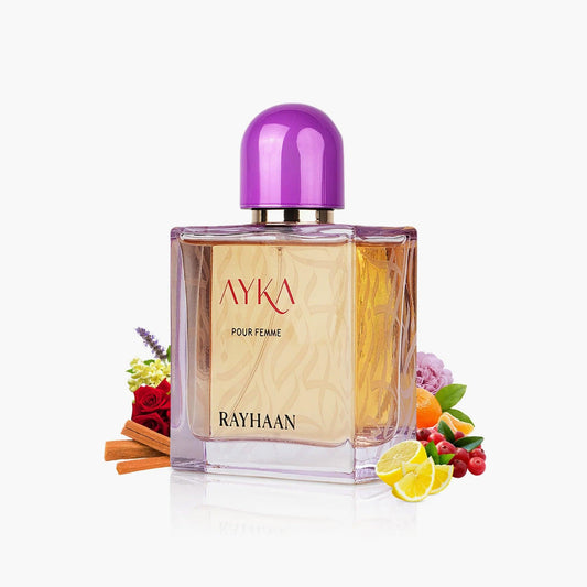 Rayhaan Ayka Pour Femme Eau De Parfum bottle with purple cap surrounded by lemon slices, cinnamon, roses, and colorful fruits on a white background
