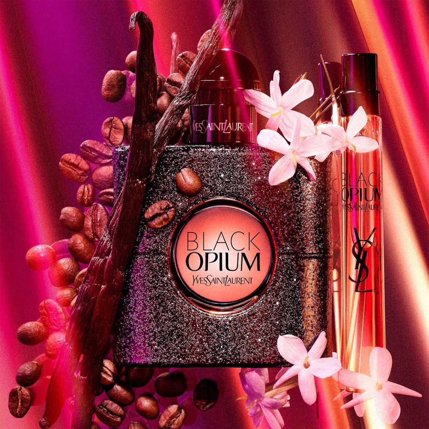 YSL Black Opium perfume bottle with coffee beans and white flowers on Pink Glowing Background