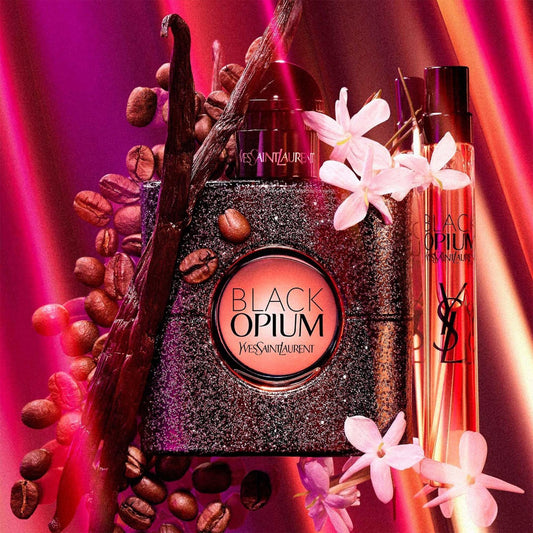YSL Black Opium perfume bottle with coffee beans and white flowers on Pink Glowing Background