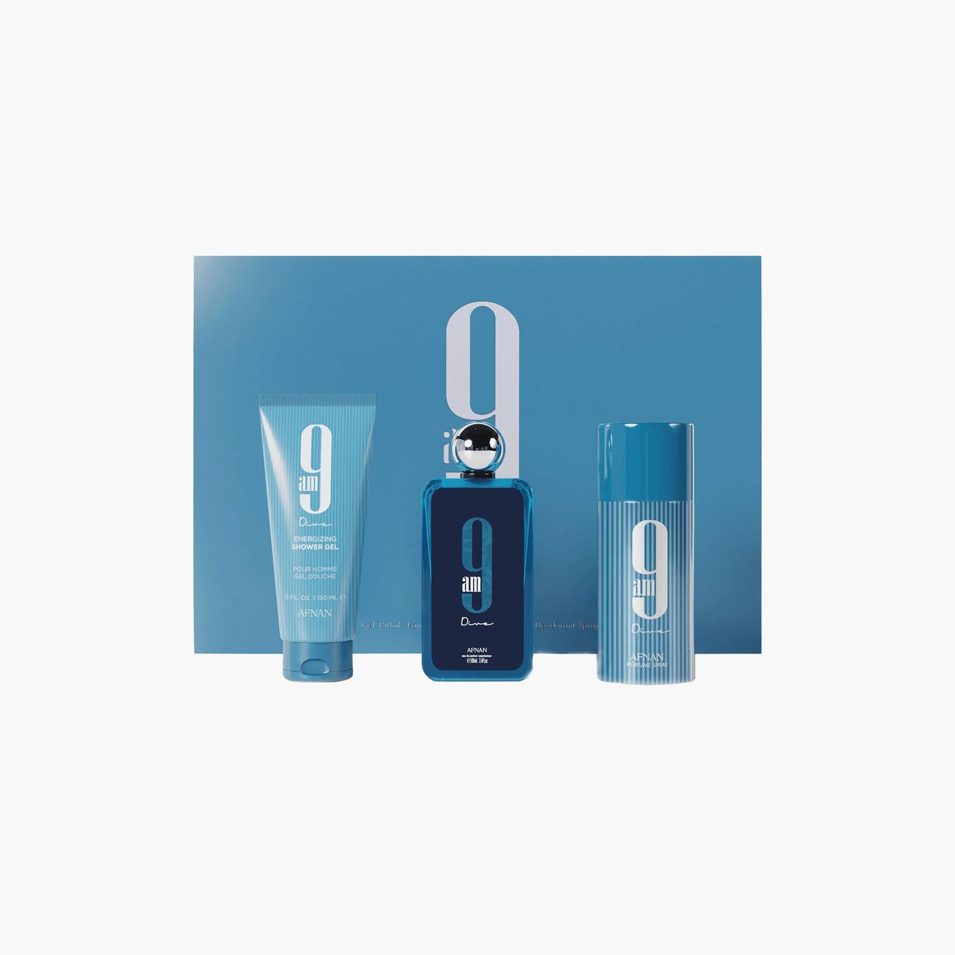 Afnan 9AM Pour Femme gift set featuring a stylish blue perfume bottle, matching shower gel, and deodorant spray, all presented in front of a blue box with white branding.