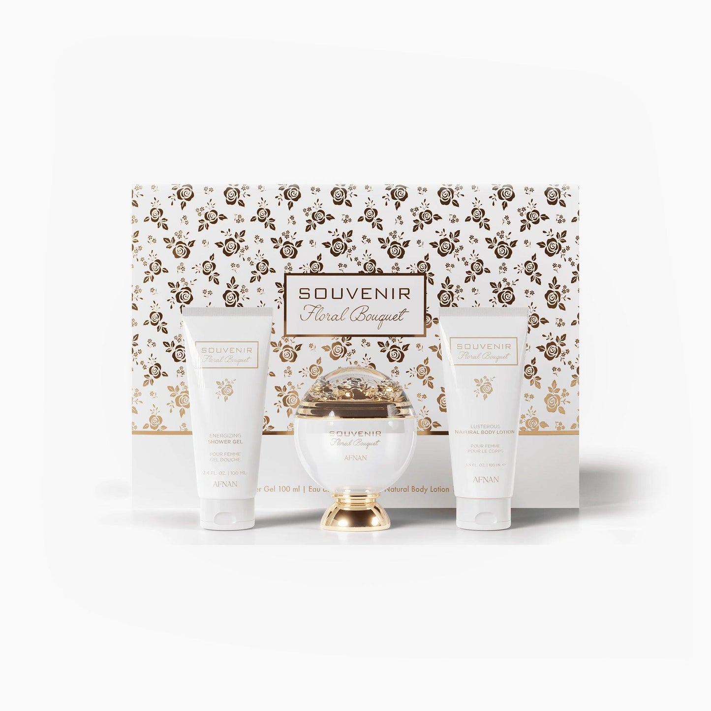 Afnan Souvenir Floral Bouquet gift set featuring a white and gold perfume bottle, matching shower gel, and body lotion placed in front of an elegant floral-patterned presentation box.