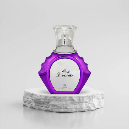 Oud Lavender Eau De Parfum 75ml in a stylish purple and silver bottle with an ornate transparent cap placed on a white stone base against a light background