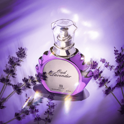 Oud Lavender Eau De Parfum 75ml bottle in a radiant purple setting surrounded by fresh lavender flowers, highlighting its elegant design and floral essence