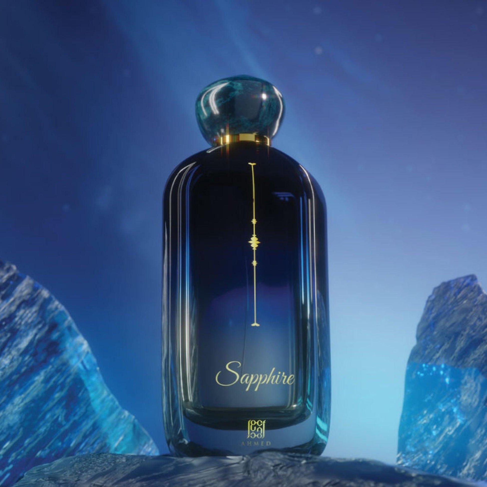 Ahmed Sapphire Eau De Parfum in a deep blue bottle with gold detailing, elegantly placed among blue stones under a cool, glowing light that enhances its luxurious appeal