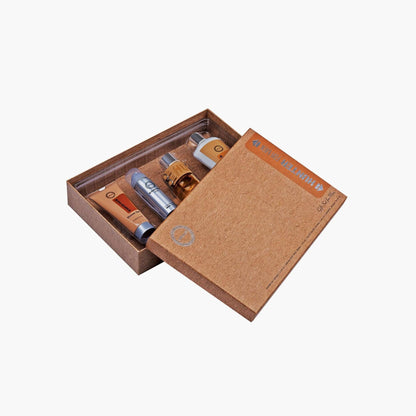 Armaf Hunter Intense gift box set featuring a perfume bottle, deodorant spray, shower gel, and body lotion arranged neatly inside a textured brown presentation box.