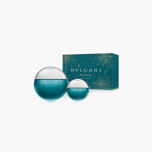 Bvlgari Aqva Pour Homme gift set featuring two round turquoise perfume bottles with a matching teal box decorated with golden starburst designs on a white background.