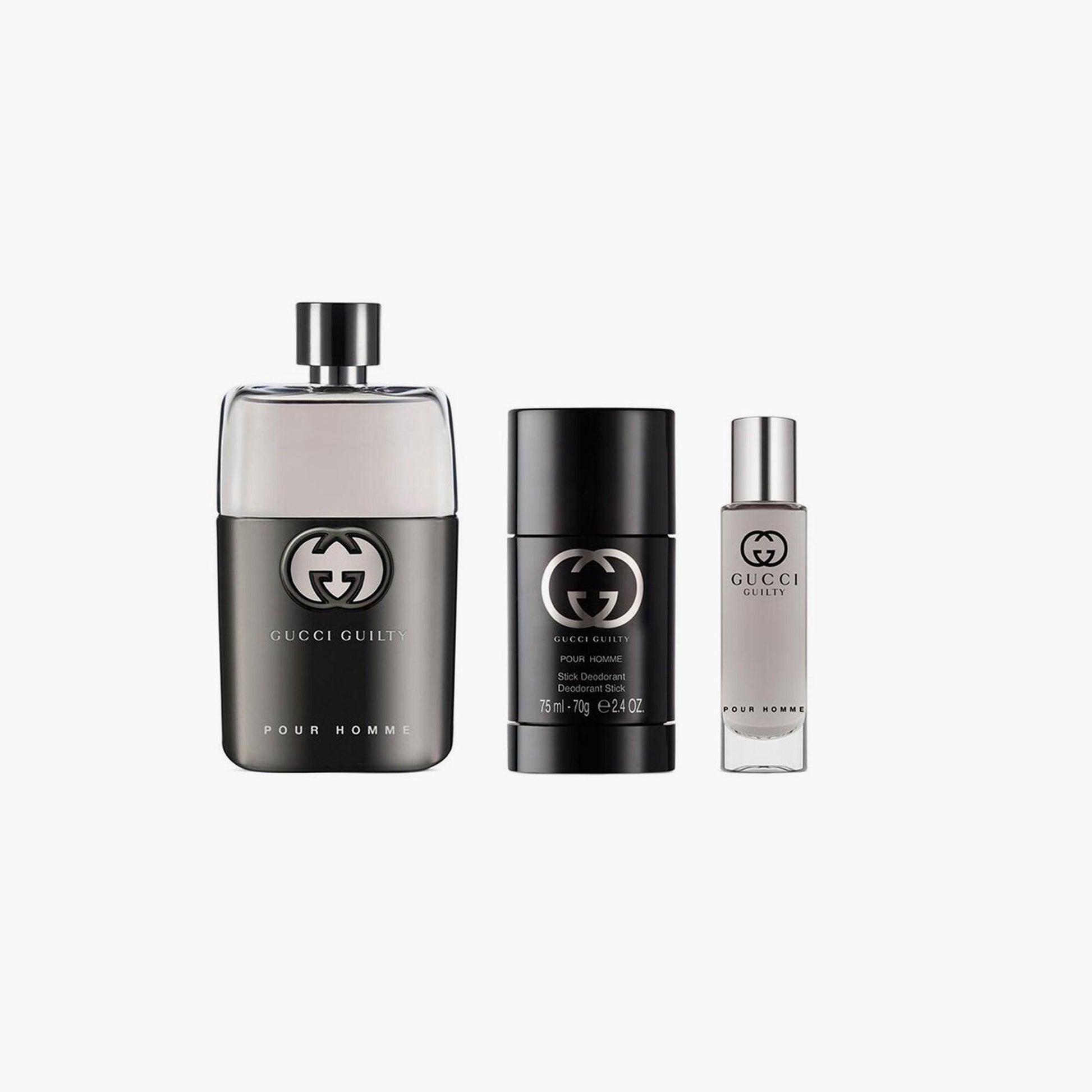 Gucci Guilty Pour Homme gift set featuring Eau De Toilette bottle, deodorant stick, and travel-size spray arranged on a white background.