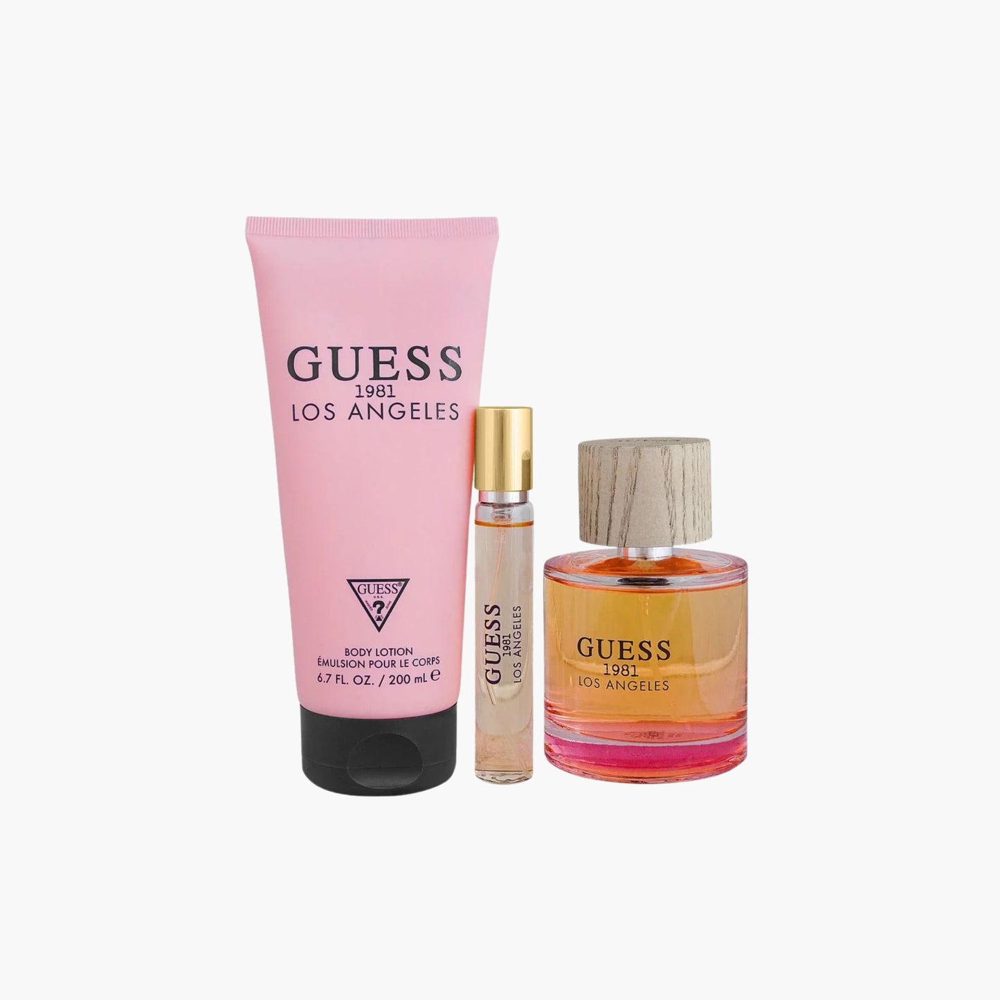 Guess 1981 Los Angeles perfume set including full-size bottle, rollerball, and body lotion on a white background