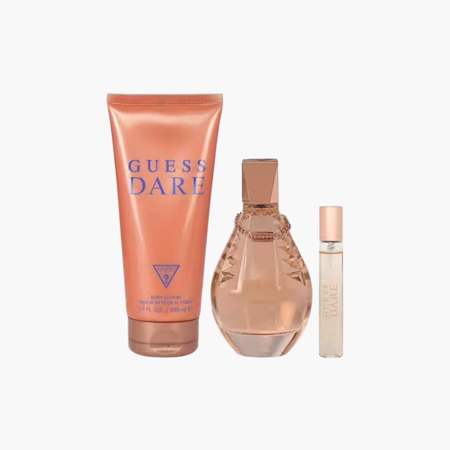 Guess Dare fragrance set with Eau De Toilette bottle, body lotion, and rollerball in rose gold packaging