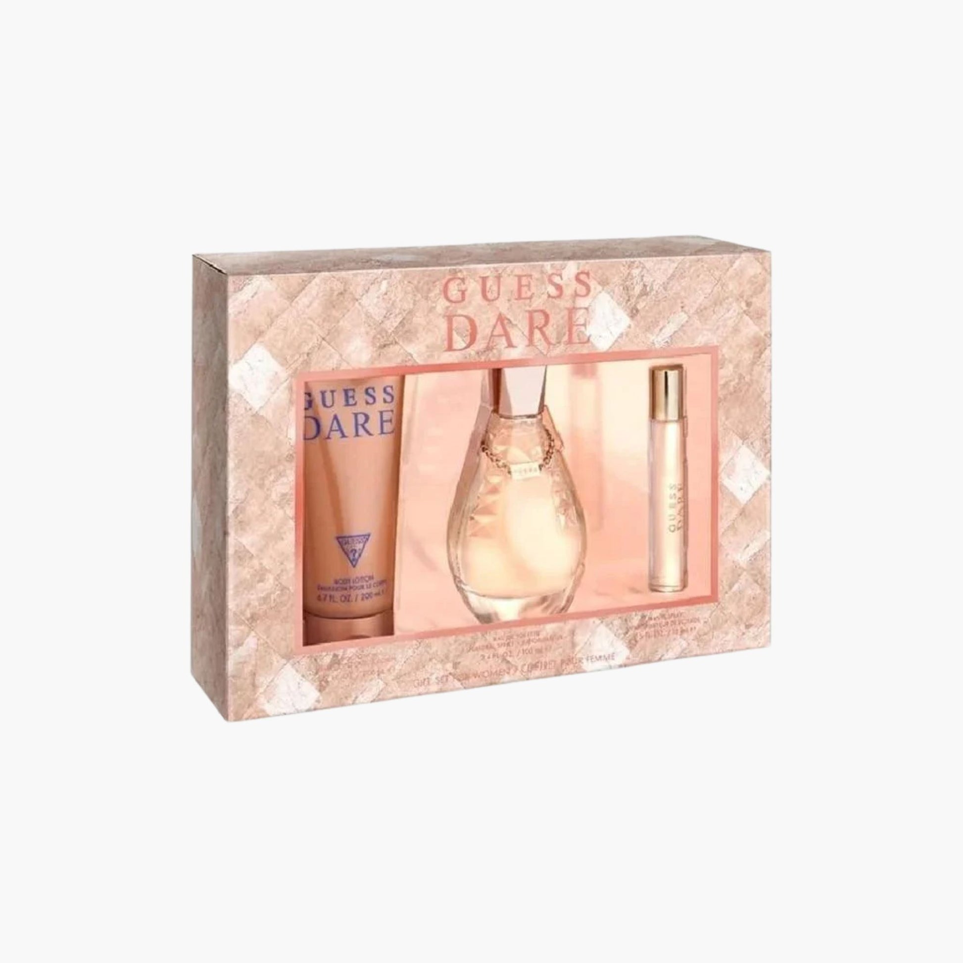Guess Dare fragrance gift set with body lotion, Eau De Toilette bottle, and rollerball in rose gold packaging, presented in a decorative box
