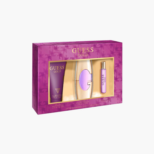 Guess Gold fragrance gift set with Eau De Toilette bottle, body lotion, and rollerball in purple and gold packaging