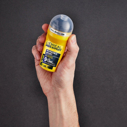 L’Oreal Men Expert Invincible Sport deodorant roll-on held against dark gray background