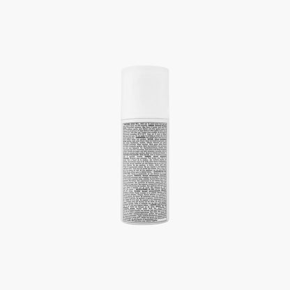 White cylindrical skincare product bottle with black printed text label displayed against a plain white background