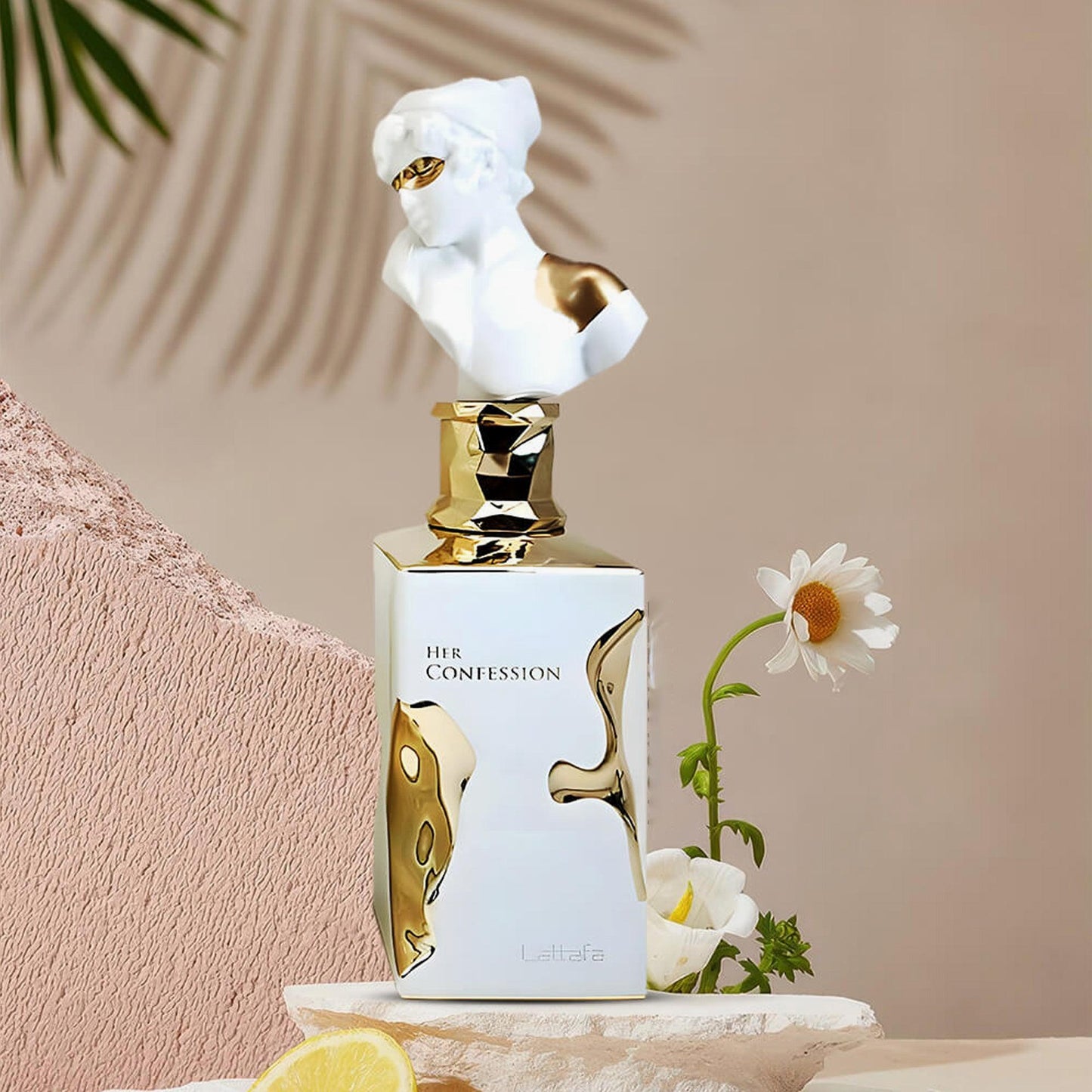 Lattafa Her Confession perfume bottle with gold-white design and bust cap beside flowers and lemon.