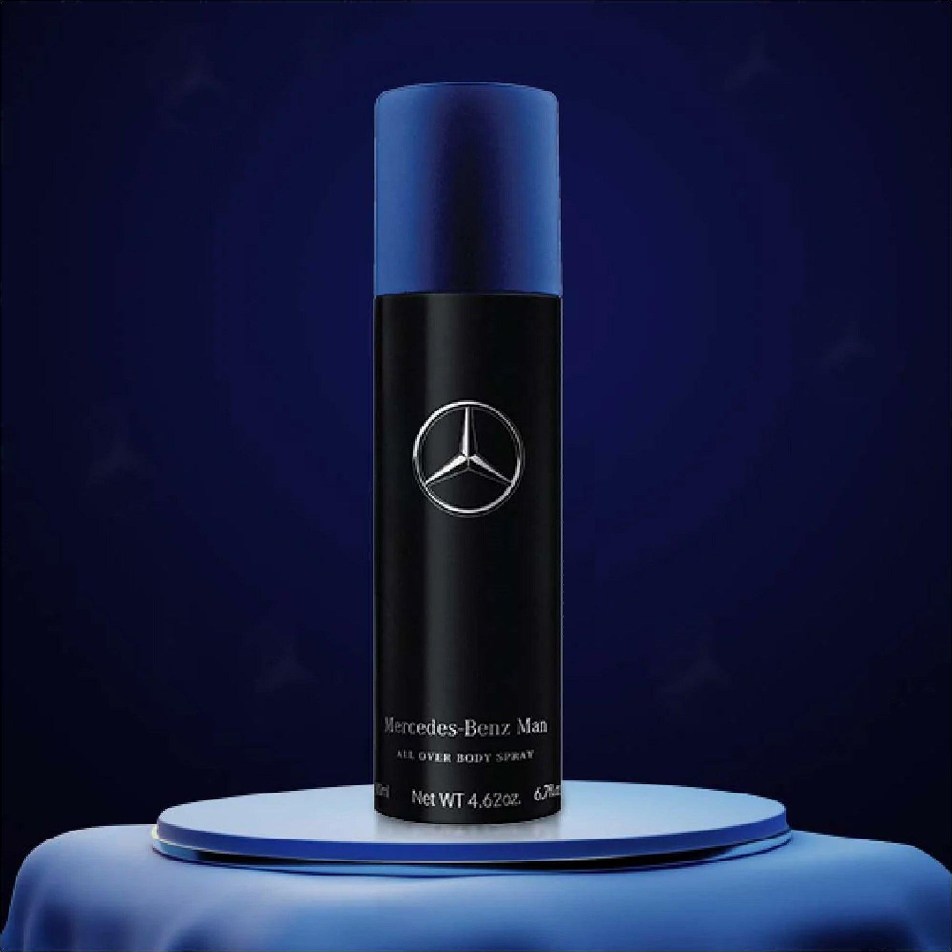 Mercedes-Benz Man All Over Body Spray showcased on a round blue platform with a deep navy background, emphasizing its sleek black and blue design and premium masculine appeal