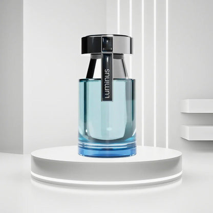Rue Broca Luminous Eau De Parfum bottle in sleek blue glass design with black cap displayed on a glowing white pedestal background