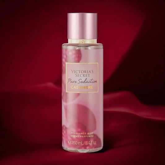 Victorias Secret Pure Seduction Cashmere fragrance mist 250ml bottle in soft pink design placed against a rich red satin fabric background