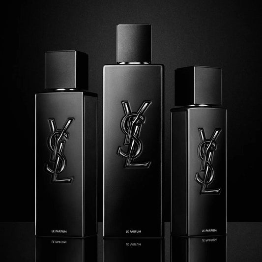 Yves Saint Laurent Le Parfum black bottles displayed in a sleek arrangement against a dark background, showcasing the iconic embossed YSL logo